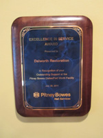 Dalworth Restoration receives exellence in service award from pitney bowes