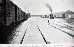 train cars sitting on flooded tracks