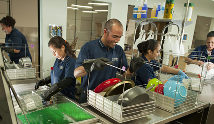 Dalworth technicians cleaning contents at our in house facility