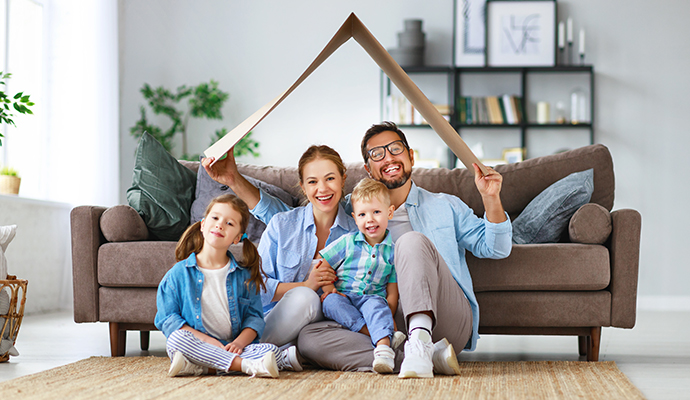 Happy family sitting inside living room Happy family sitting inside living room