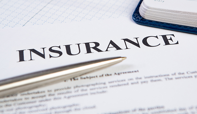 Insurance document closeup with pen on desk