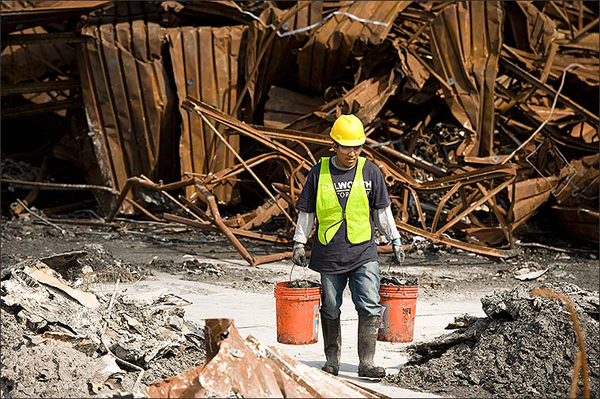 Technician cleaning up fire damaged debris