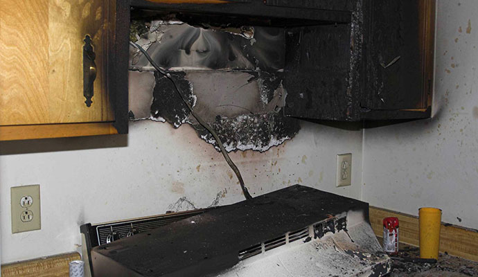 Fire damaged kitchen Fire damaged kitchen
