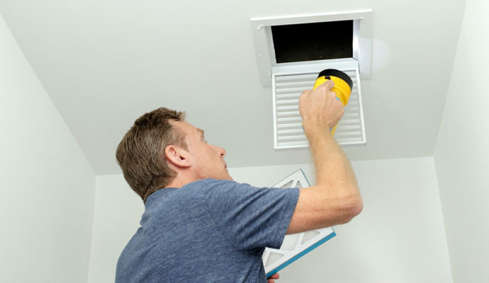 Technician inspecting HVAC system