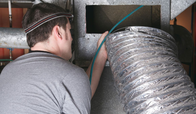 HVAC technician air duct cleaning