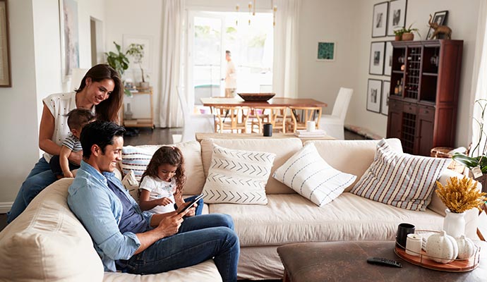 Happy family enjoying leisure time together in the living room
