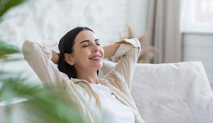 A person is relaxing in improved indoor air quality A person is relaxing in improved indoor air quality