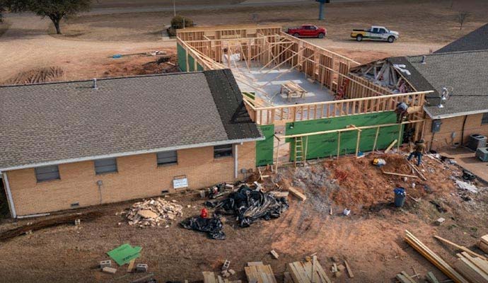 Residential house undergoing structural reconstruction Residential house undergoing structural reconstruction
