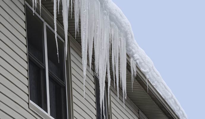Heavy snow buildup on roofline
