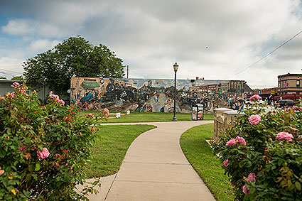 A wall mural at Olde City Park in downtown Wylie, TX depicts the city's rich history and culture.