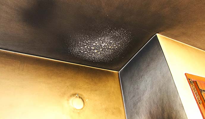 Soot damaged wall and ceiling Soot damaged wall and ceiling