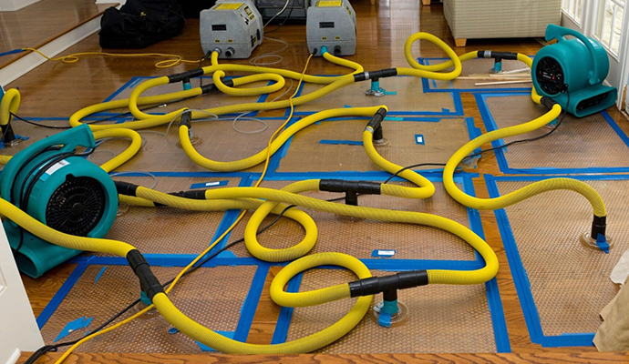 Water damage restoration service using equipment