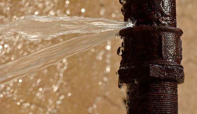 Burst water pipe leaking water