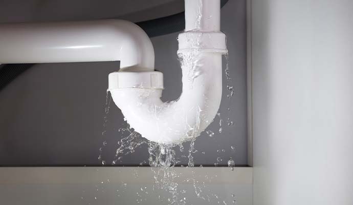 Leaking plumbing pipe under sink