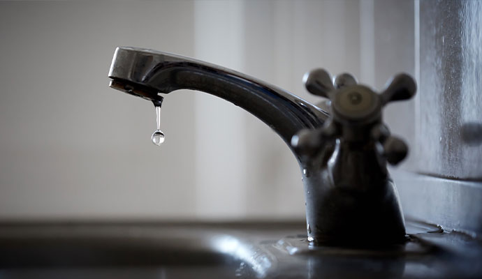 Old faucet leaking water