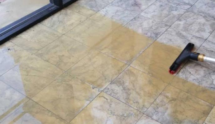 Professional tile and grout cleaning with equipment