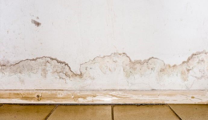 Interior drywall with water stains and visible damage