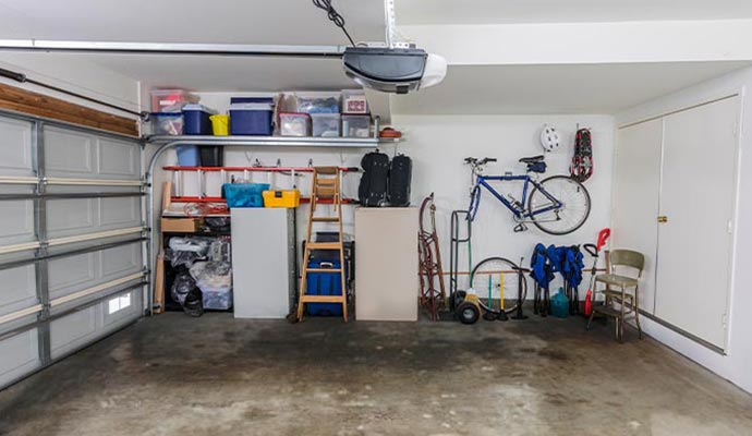 Garage floor showing visible water damage and pooling water