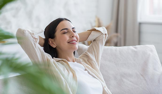 Woman enjoying fresh air in the living room